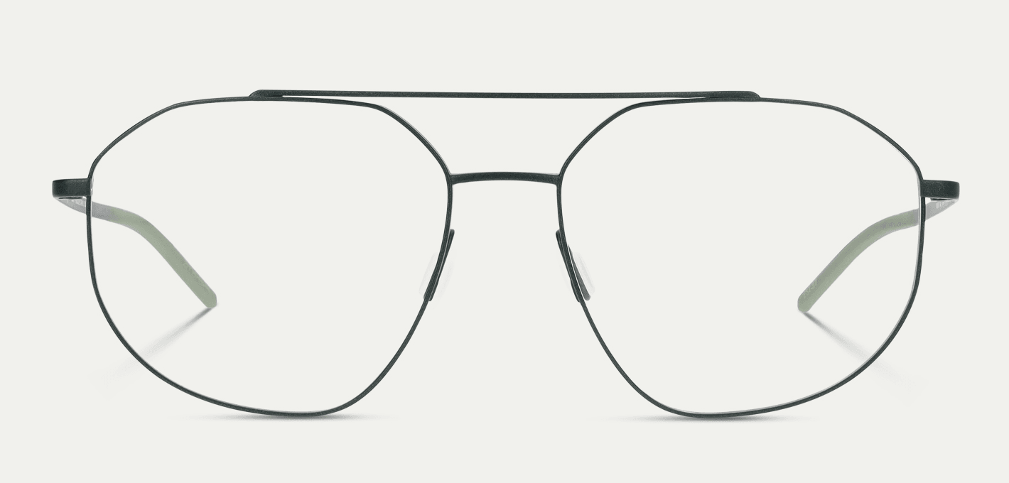 Close-up of black metal round eyeglasses with a double bridge, resting on a light background.
