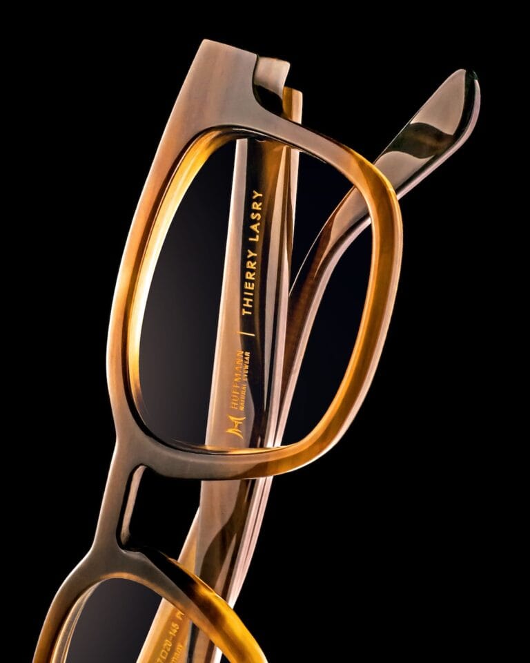 Close-up of Brown Translucent Eyeglasses Frames (thierry Lasry) Against a Black Background, Highlighting the Thick, Rounded Temple and Glossy Lenses.  | Eyestylist 21st April 2026