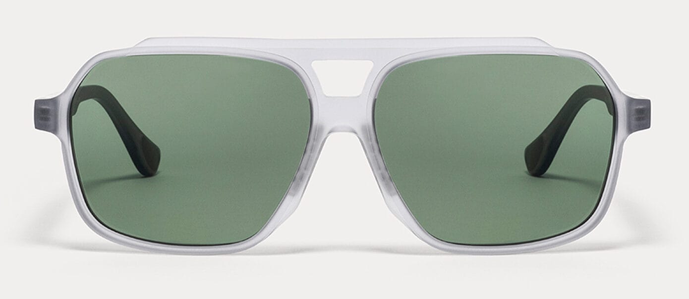 Front view of white sunglasses with green lenses on a white background.
