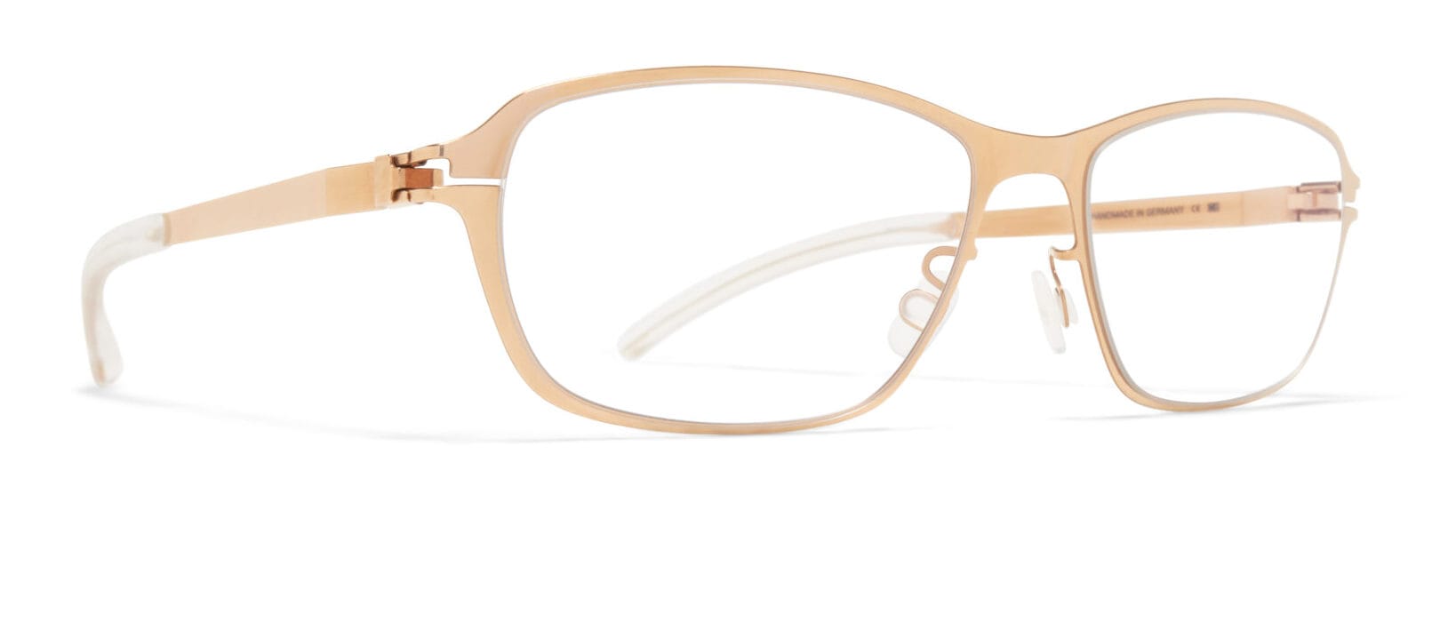 Rose-gold metal eyeglasses with rectangular lenses on a white background, showing nose pads and slim arms at the edges of the frame