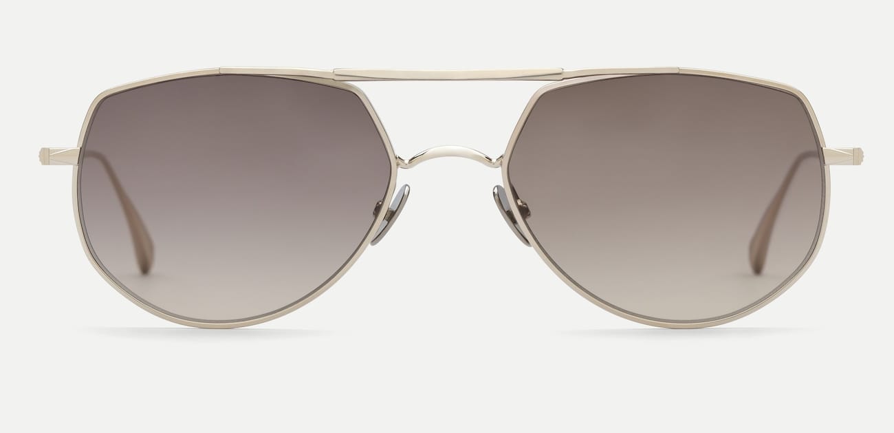 AHLEM_FW26_CADET_Grey Gold Brushed_01_grey | Eyestylist Aviator Sunglasses with a Gold Metal Frame and Gradient Brown Lenses on a Light Background. | Eyestylist 8th September 2026